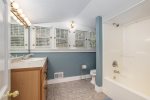 Upstairs bathroom with a shower tub combo